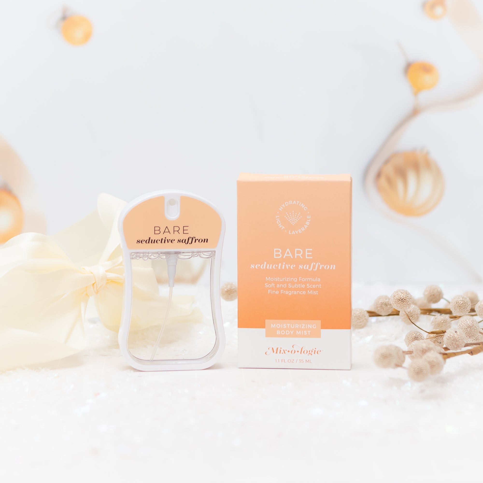 MBM-BARE_body_mist_styled_for_christmas_and_holidays_with_ivory_bow_and_other_gold_ornaments.jpg