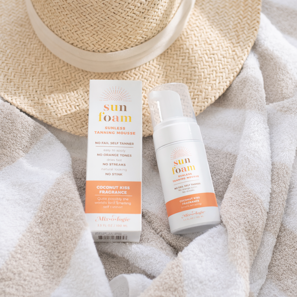 Sunny_tanning_essentials_on_neutral_towel.png