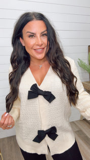 Ultra Soft Ivory Ribbed Knit Cardi With Black Bow Detail